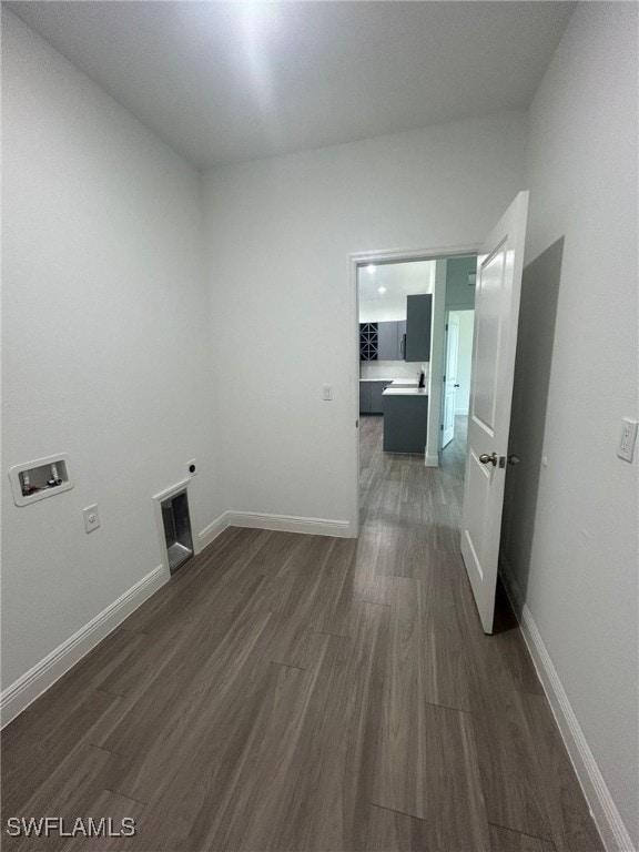 washroom featuring electric dryer hookup, dark hardwood / wood-style floors, and washer hookup