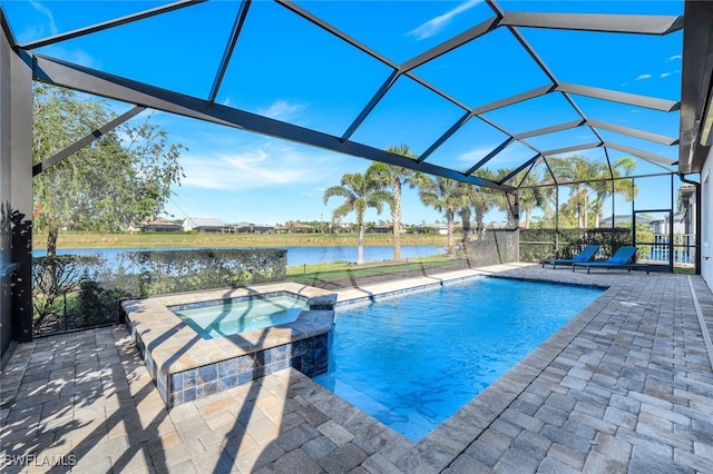 view of pool with a patio area, a water view, glass enclosure, and an in ground hot tub