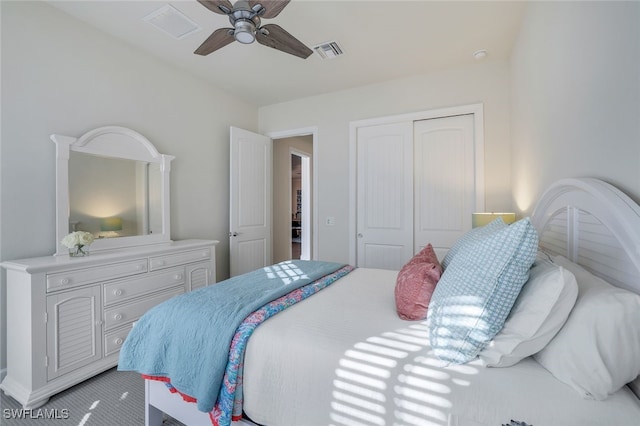 carpeted bedroom with a closet and ceiling fan