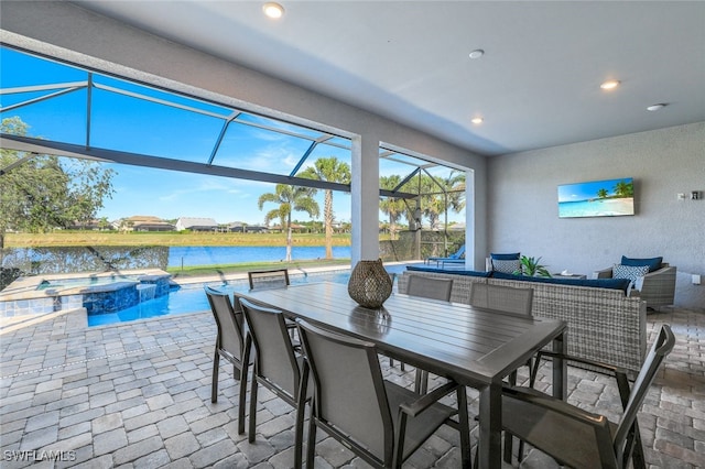 interior space with a patio, outdoor lounge area, a lanai, and a pool with hot tub