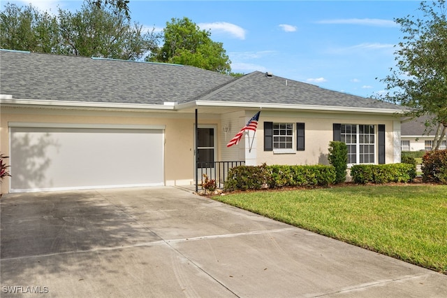 single story home featuring a garage and a front lawn