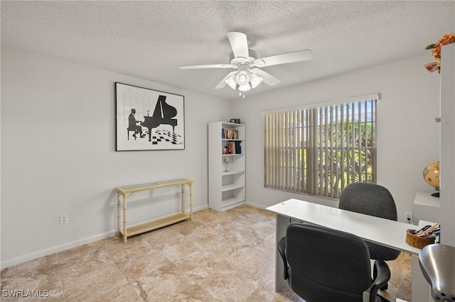 home office with a textured ceiling and ceiling fan