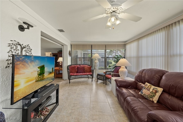 living room with ceiling fan and light tile patterned floors