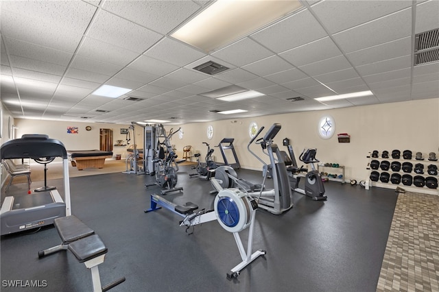 exercise room with a paneled ceiling