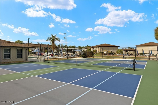 view of tennis court featuring basketball court