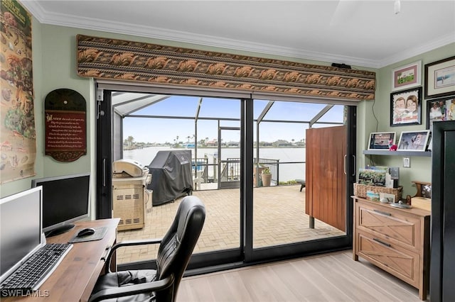 doorway to outside with light wood-type flooring, ornamental molding, and a water view