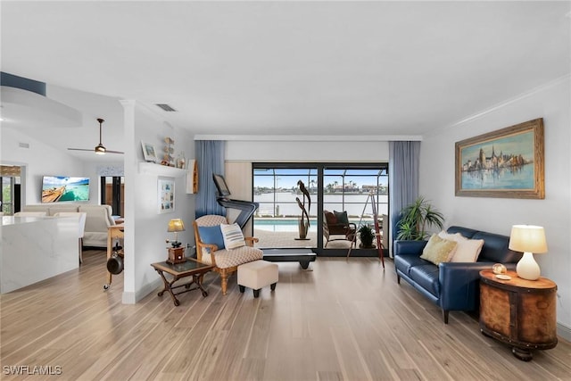 sitting room with ceiling fan, plenty of natural light, light hardwood / wood-style flooring, and ornamental molding