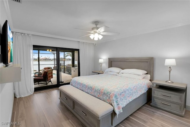 bedroom featuring access to exterior, light hardwood / wood-style flooring, and ornamental molding