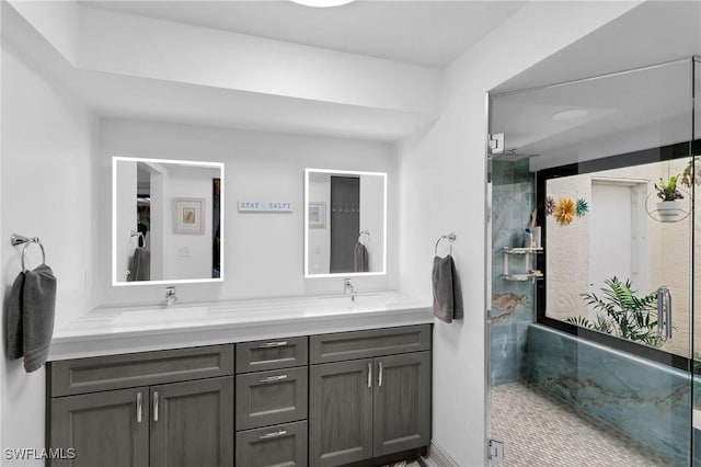 bathroom with an enclosed shower and vanity