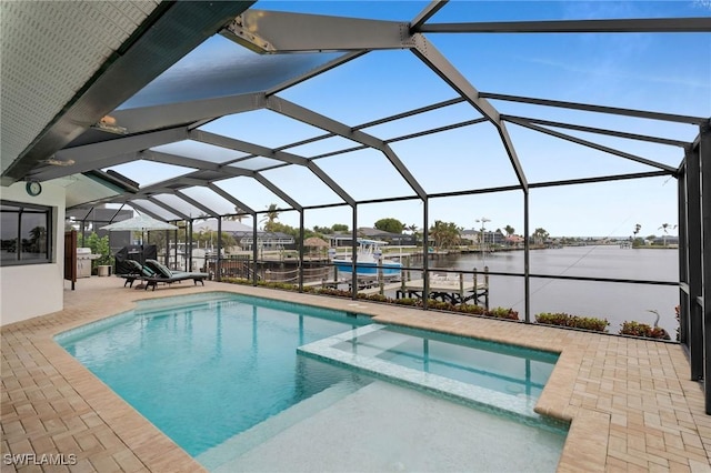 view of swimming pool featuring a water view, a patio area, and glass enclosure