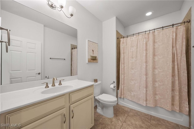 full bathroom with tile patterned flooring, vanity, toilet, and shower / bath combo with shower curtain