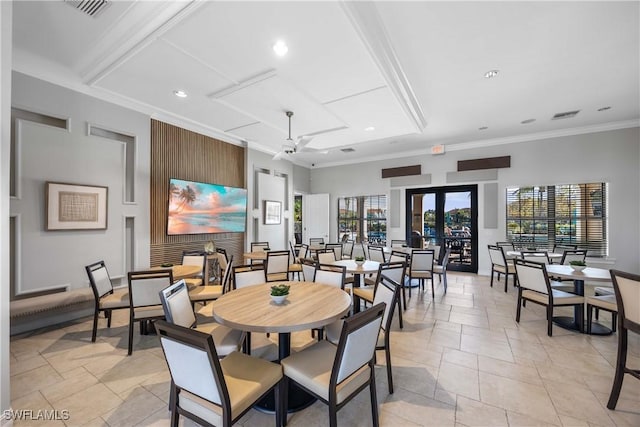 dining area with ornamental molding and ceiling fan