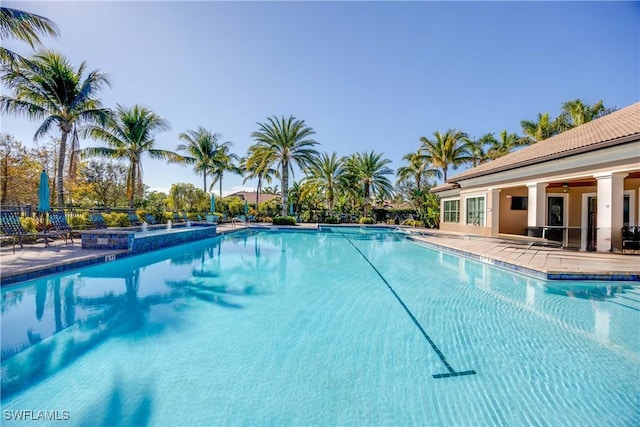 view of swimming pool featuring a patio area