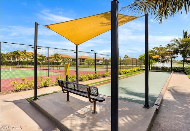 surrounding community featuring tennis court