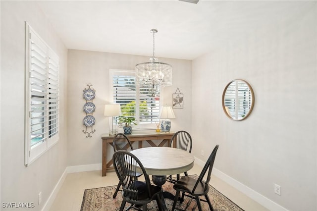 dining space featuring a notable chandelier