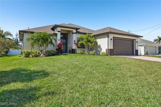 view of front of house featuring a garage and a front yard