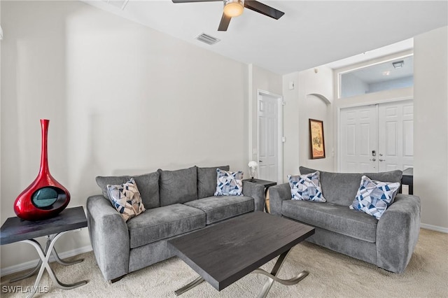 living room with light carpet and ceiling fan