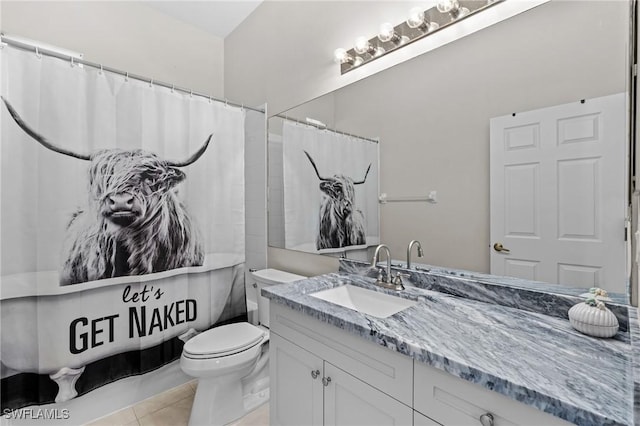 bathroom with tile patterned flooring, vanity, a shower with shower curtain, and toilet