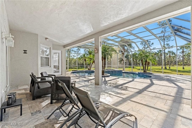 view of patio with a pool with hot tub and glass enclosure