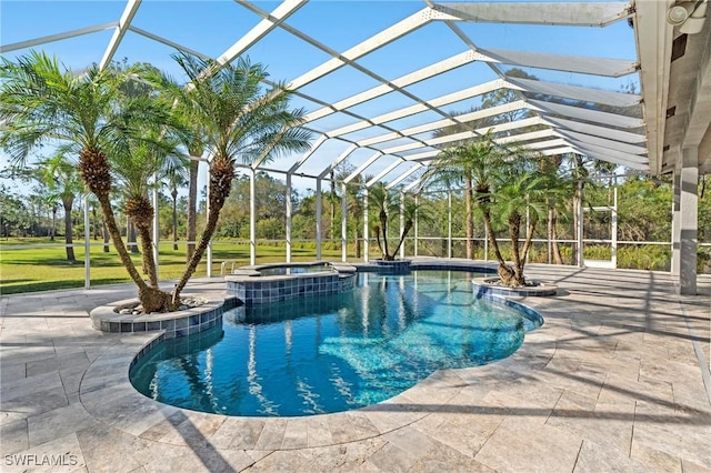 view of swimming pool featuring an in ground hot tub, a lanai, and a patio area