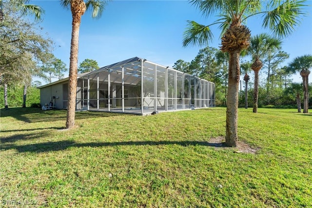 view of yard with glass enclosure