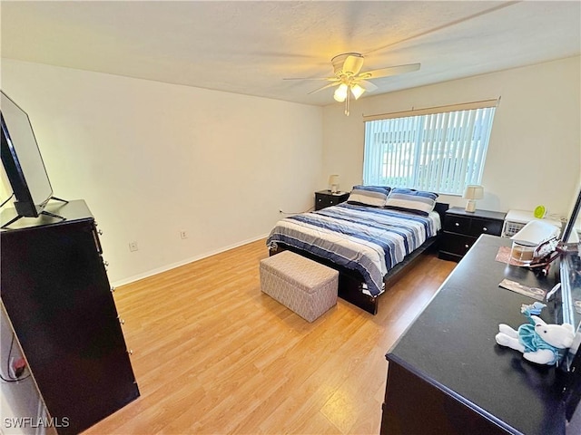 bedroom with hardwood / wood-style flooring and ceiling fan