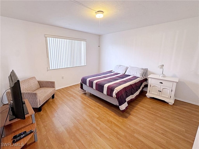 bedroom with light hardwood / wood-style flooring