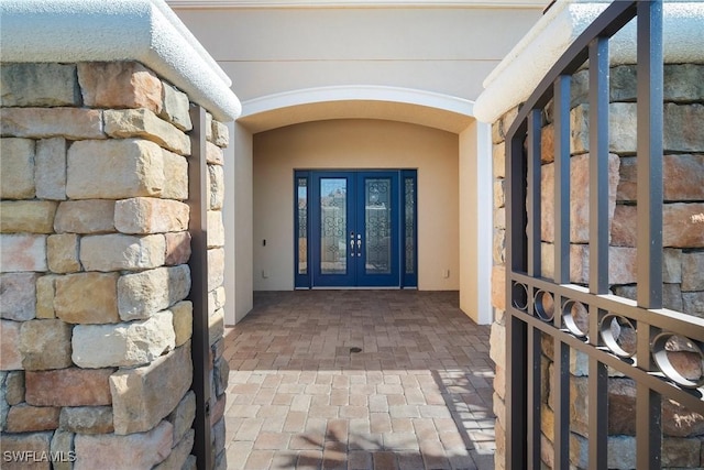 entrance to property featuring french doors