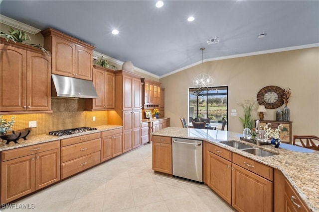 kitchen featuring lofted ceiling, sink, light stone counters, pendant lighting, and stainless steel appliances