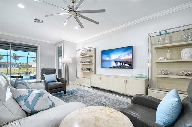 living room featuring ornamental molding and ceiling fan