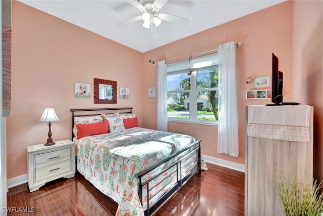 bedroom featuring dark hardwood / wood-style flooring and ceiling fan