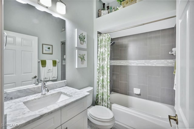 full bathroom with vanity, shower / tub combo, and toilet