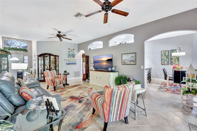 tiled living room featuring ceiling fan