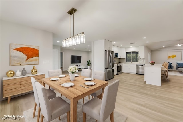 dining space with light wood-type flooring