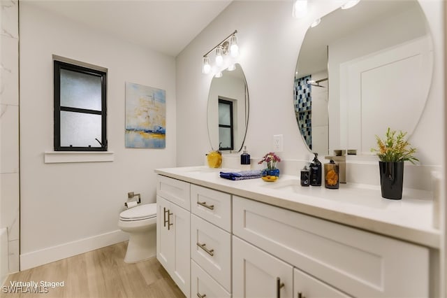 bathroom with hardwood / wood-style flooring, vanity, toilet, and a shower with curtain