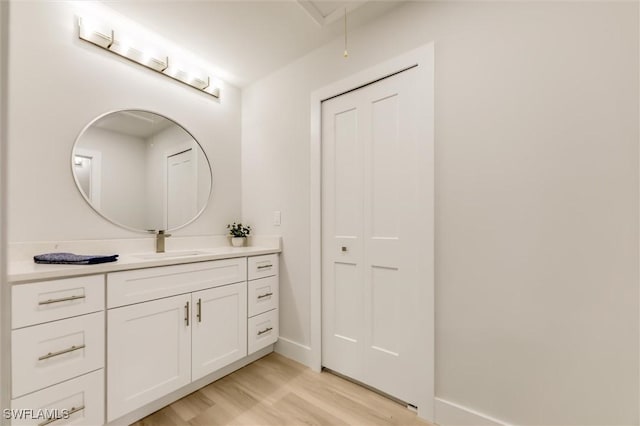 bathroom featuring vanity and hardwood / wood-style floors