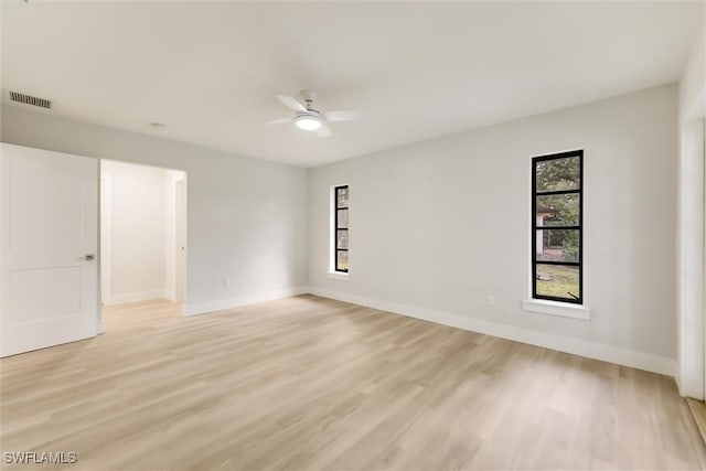 unfurnished room featuring ceiling fan and light hardwood / wood-style flooring