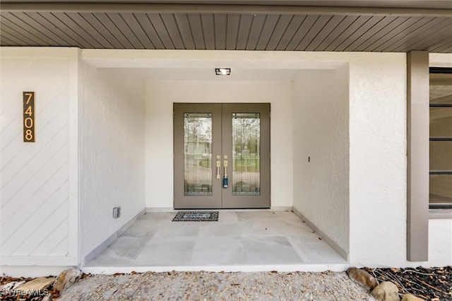 doorway to property featuring french doors