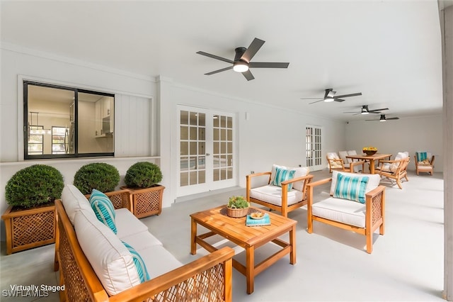 interior space with french doors and ceiling fan