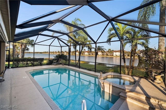 view of swimming pool featuring an in ground hot tub, a water view, glass enclosure, and a patio area