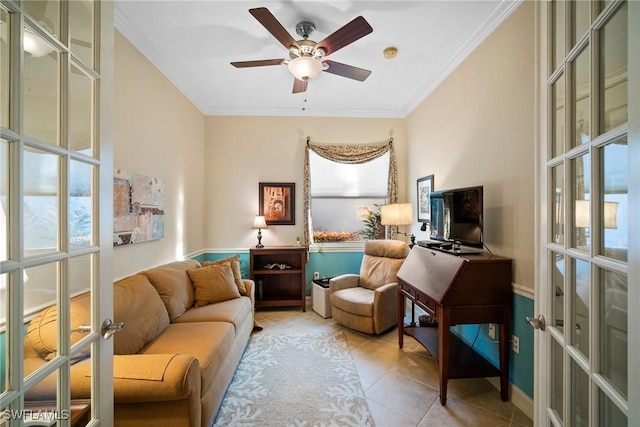 living area with light tile patterned floors, crown molding, french doors, and ceiling fan