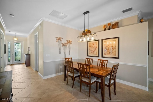 tiled dining room with crown molding