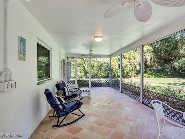 sunroom / solarium with ceiling fan