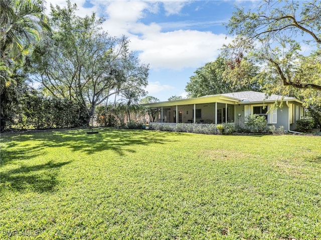 view of yard with a sunroom