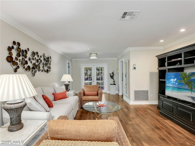 living room featuring french doors, wood-type flooring, and crown molding