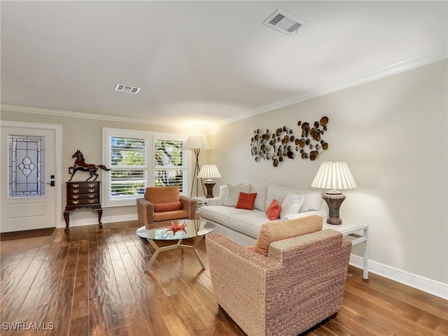 living room featuring ornamental molding and hardwood / wood-style floors