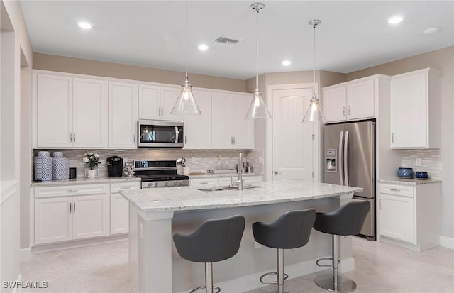 kitchen with sink, white cabinets, and appliances with stainless steel finishes