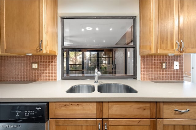 kitchen with dishwasher, sink, and decorative backsplash