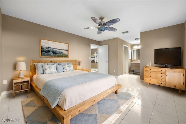 bedroom featuring ceiling fan, connected bathroom, and light tile patterned floors