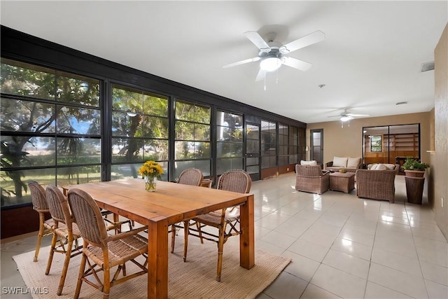 sunroom with ceiling fan and plenty of natural light